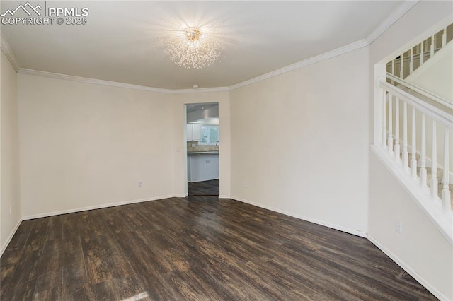 4730 Jenson Ln, Colorado Springs, CO 80922 - spare room featuring wood finished floors, crown molding, baseboards, and a chandelier