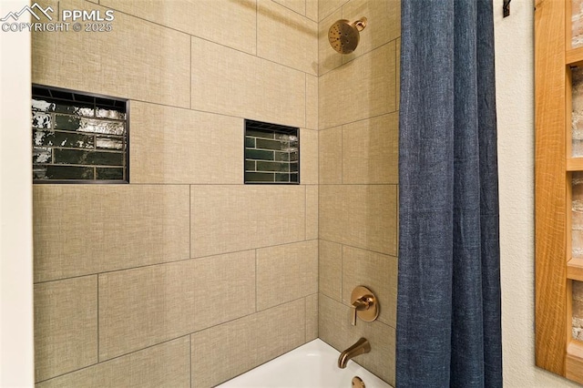 bathroom with shower / tub combo with curtain