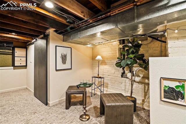 unfinished basement featuring carpet floors and baseboards