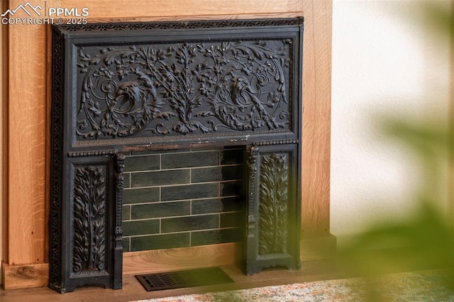 details with visible vents and a fireplace