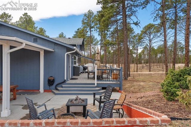6770 Gun Club Trl, Colorado Springs, CO 80908 - view of patio with a fire pit and a deck
