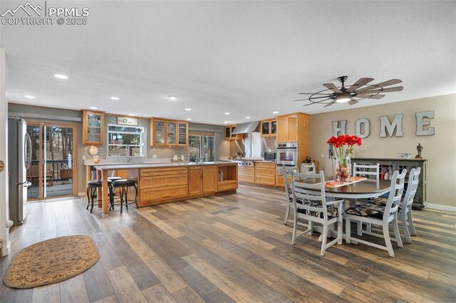 6770 Gun Club Trl, Colorado Springs, CO 80908 - dining room with recessed lighting, ceiling fan, baseboards, and dark wood-style flooring