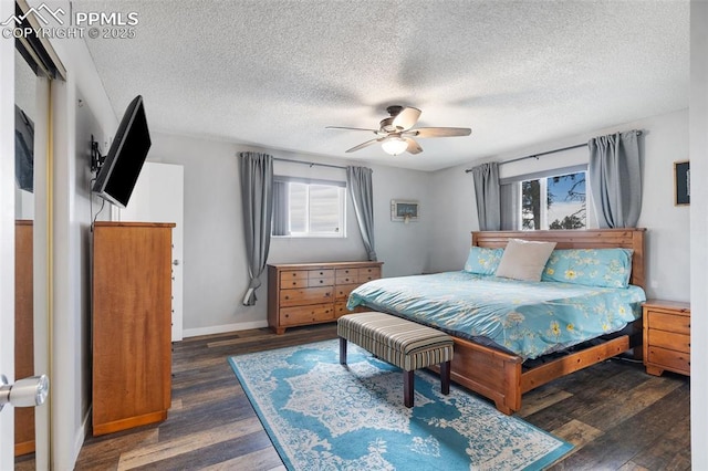 6770 Gun Club Trl, Colorado Springs, CO 80908 - bedroom with a textured ceiling, wood finished floors, baseboards, and ceiling fan