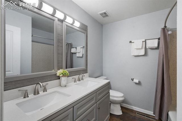 6770 Gun Club Trl, Colorado Springs, CO 80908 - bathroom with a sink, visible vents, and toilet