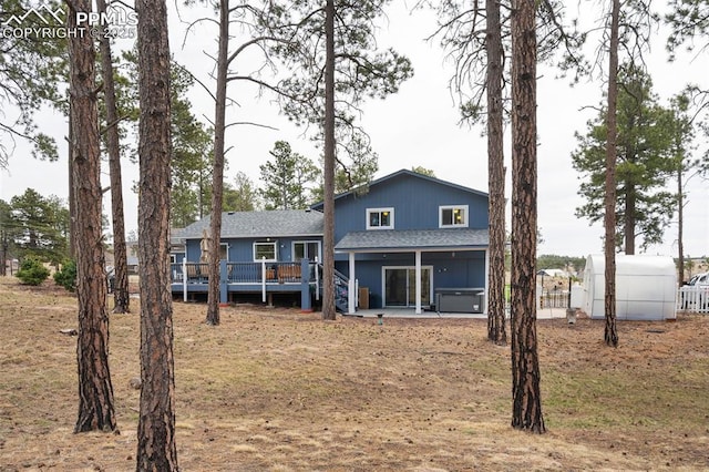 6770 Gun Club Trl, Colorado Springs, CO 80908 - rear view of house featuring a patio, roof with shingles, and a wooden deck