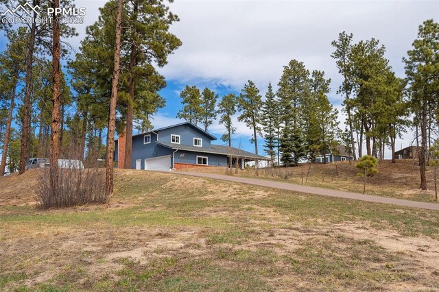 6770 Gun Club Trl, Colorado Springs, CO 80908 - view of front of house featuring a garage