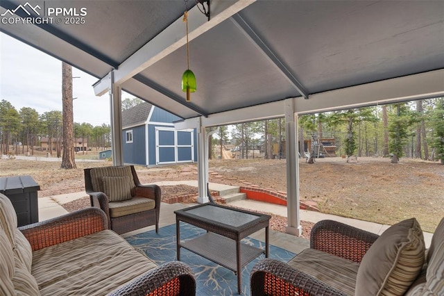6770 Gun Club Trl, Colorado Springs, CO 80908 - view of patio / terrace featuring an outbuilding and an outdoor living space