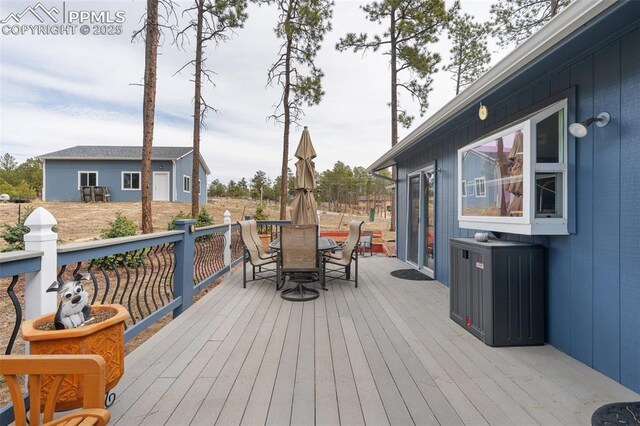 6770 Gun Club Trl, Colorado Springs, CO 80908 - deck with outdoor dining area