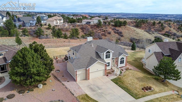 birds eye view of property with a residential view