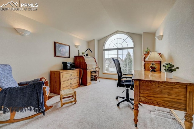 office space featuring carpet floors, a textured wall, and lofted ceiling
