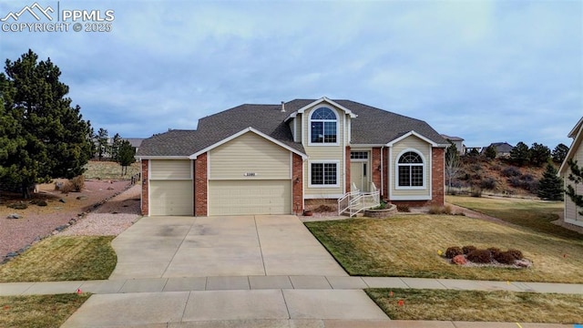 traditional-style home with concrete driveway, an attached garage, brick siding, a front lawn, and a shingled roof