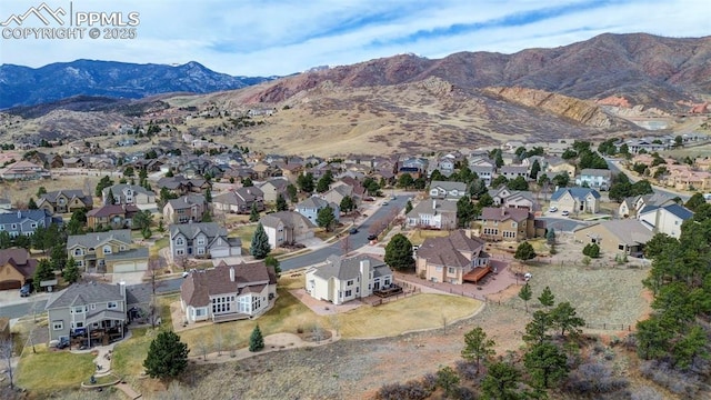 aerial view with a mountain view and a residential view