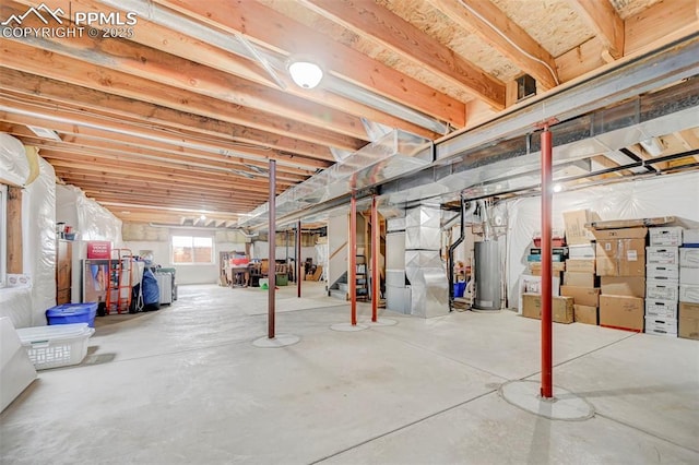 below grade area featuring stairway and gas water heater