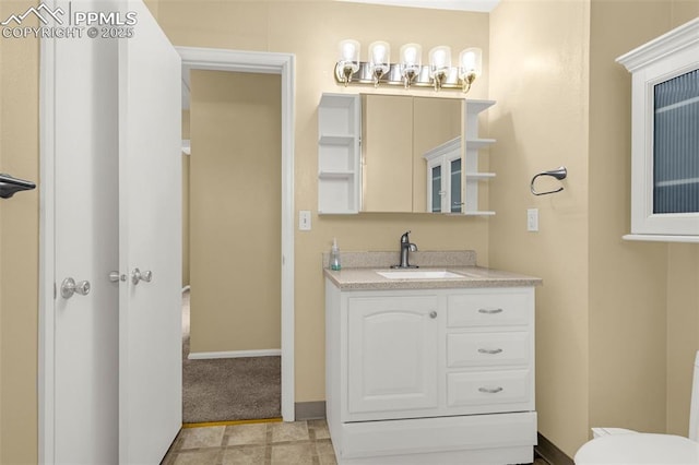 3781 Red Cedar Dr, Colorado Springs, CO 80906 - bathroom featuring vanity, baseboards, and toilet