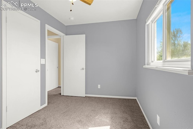 3781 Red Cedar Dr, Colorado Springs, CO 80906 - unfurnished bedroom with baseboards, ceiling fan, and carpet