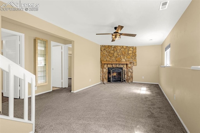 3781 Red Cedar Dr, Colorado Springs, CO 80906 - unfurnished living room with carpet floors, visible vents, a fireplace, baseboards, and a ceiling fan