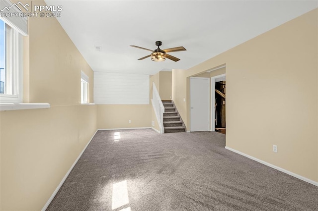3781 Red Cedar Dr, Colorado Springs, CO 80906 - spare room with a ceiling fan, visible vents, stairway, baseboards, and carpet