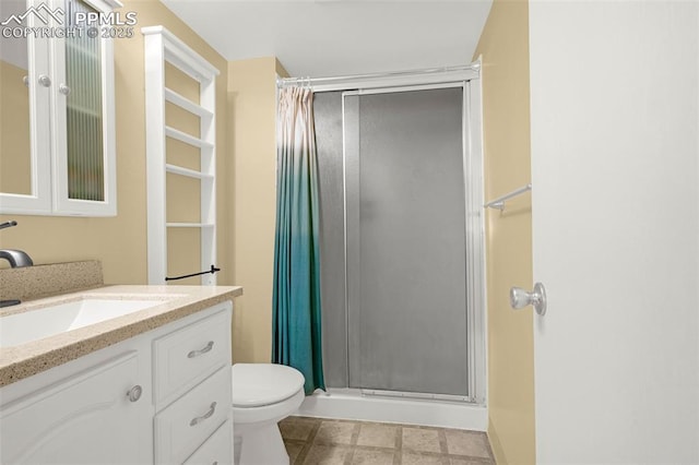 3781 Red Cedar Dr, Colorado Springs, CO 80906 - full bathroom featuring vanity, toilet, and a shower stall