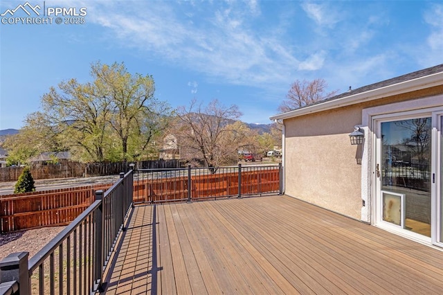 3781 Red Cedar Dr, Colorado Springs, CO 80906 - wooden terrace with a fenced backyard and a mountain view