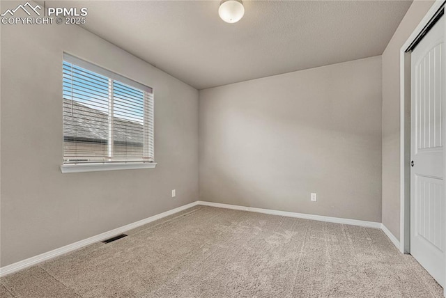 9812 Fairway Glen Dr, Peyton, CO 80831 - unfurnished room with baseboards, visible vents, and carpet