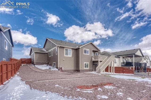 9812 Fairway Glen Dr, Peyton, CO 80831 - snow covered property with a fenced backyard and stairway