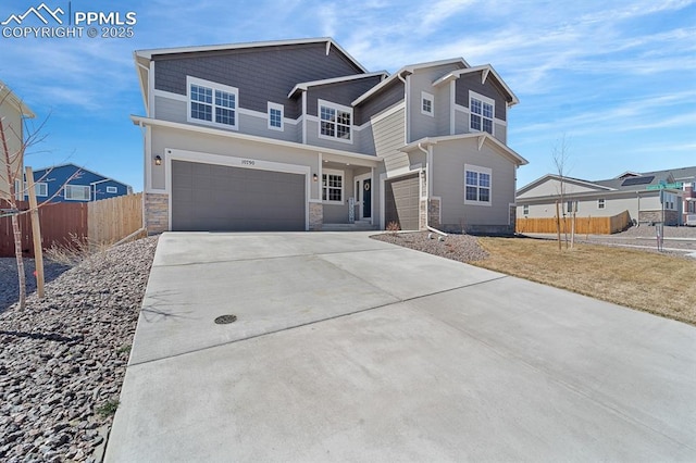 10790 Rolling Peaks Dr, Peyton, CO 80831 - view of front facade with stone siding, driveway, fence, and an attached garage
