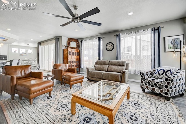 10790 Rolling Peaks Dr, Peyton, CO 80831 - living area with wood finished floors, recessed lighting, a textured ceiling, and ceiling fan