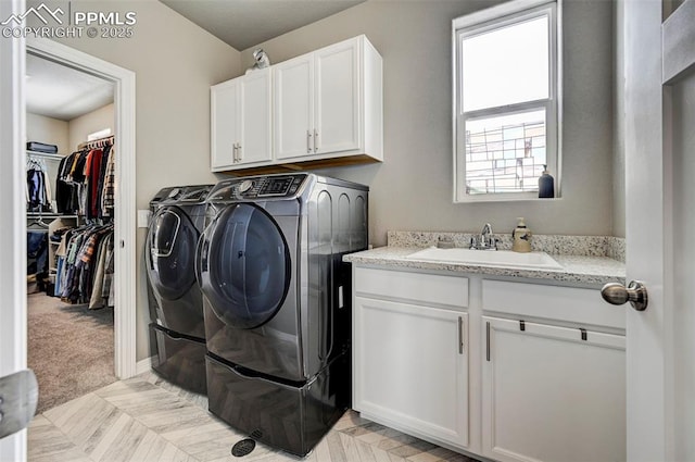 10790 Rolling Peaks Dr, Peyton, CO 80831 - laundry area with independent washer and dryer, cabinet space, and a sink