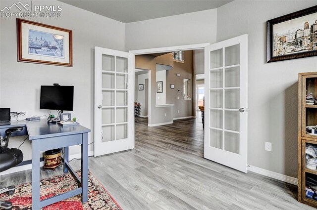 10790 Rolling Peaks Dr, Peyton, CO 80831 - office space with baseboards, wood finished floors, and french doors