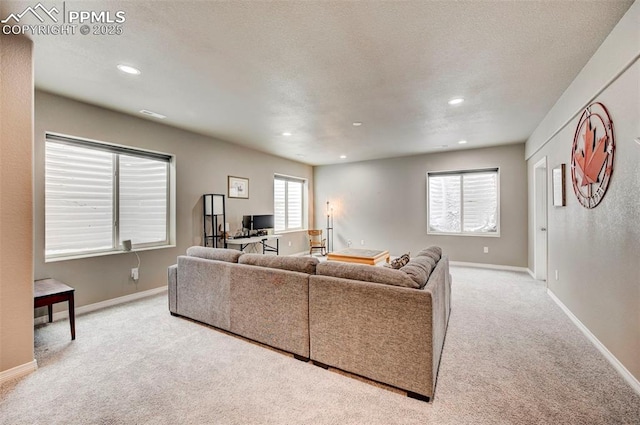 10790 Rolling Peaks Dr, Peyton, CO 80831 - living room featuring recessed lighting, carpet floors, baseboards, and a textured ceiling