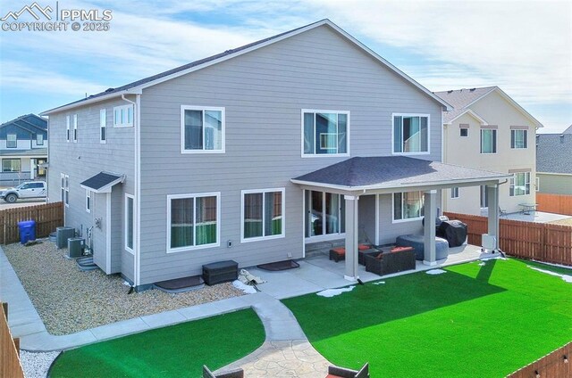 10790 Rolling Peaks Dr, Peyton, CO 80831 - rear view of house featuring a fenced backyard, central air condition unit, a yard, and a patio area
