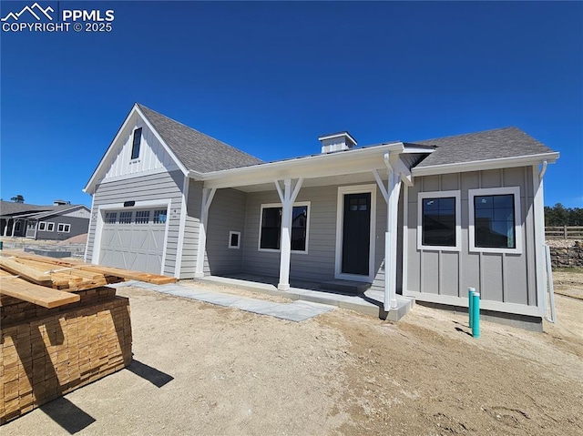 16207 Talons Bluff Ln, Monument, CO 80132 - view of front of property featuring board and batten siding, roof with shingles, and a porch