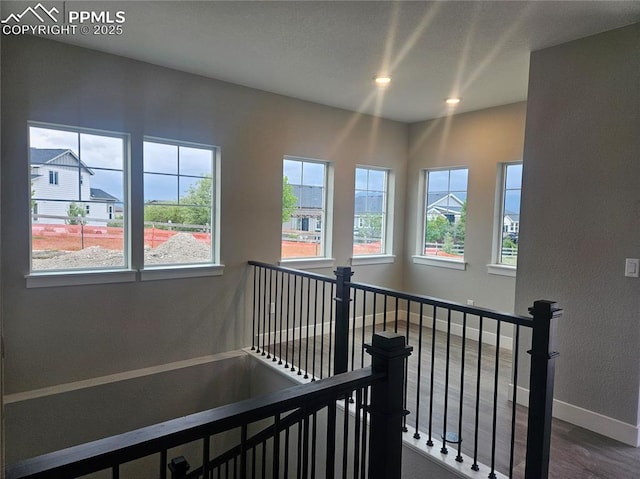 16207 Talons Bluff Ln, Monument, CO 80132 - staircase with wood finished floors and recessed lighting