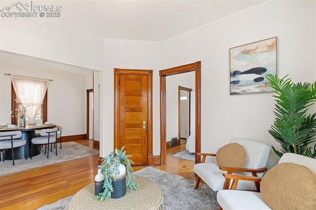 2721 W Bijou St, Colorado Springs, CO 80904 - living room featuring wood finished floors and baseboards