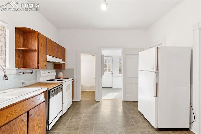 2721 W Bijou St, Colorado Springs, CO 80904 - kitchen with white appliances, under cabinet range hood, open shelves, light countertops, and a sink