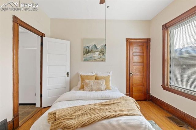 2721 W Bijou St, Colorado Springs, CO 80904 - bedroom with light wood-type flooring, baseboards, and ceiling fan