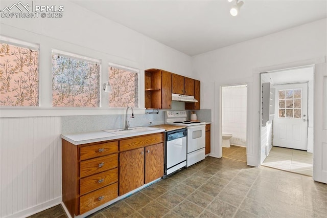 2721 W Bijou St, Colorado Springs, CO 80904 - kitchen featuring a sink, white appliances, light countertops, under cabinet range hood, and brown cabinets