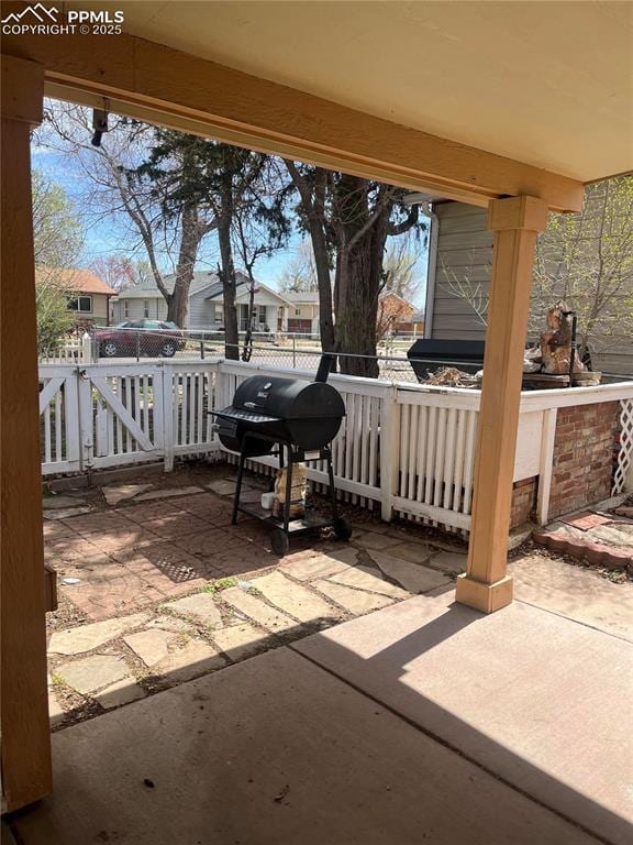 view of patio / terrace with a residential view and area for grilling