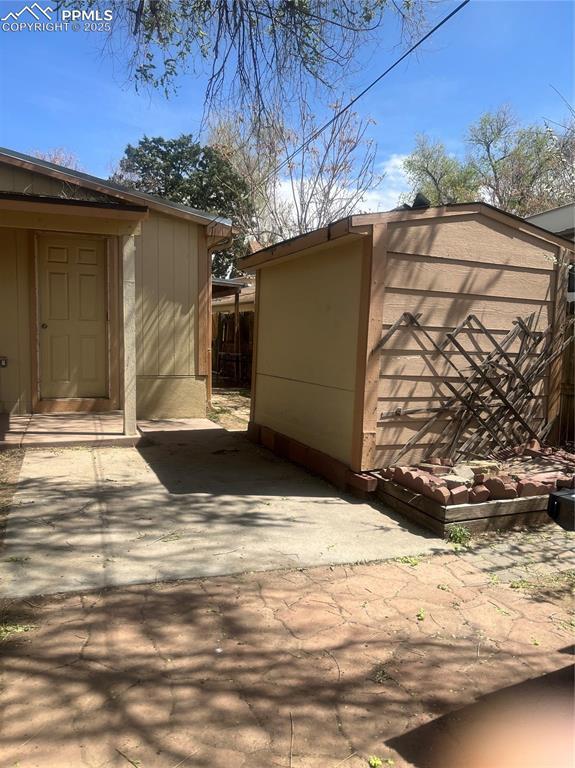 garage featuring a storage unit