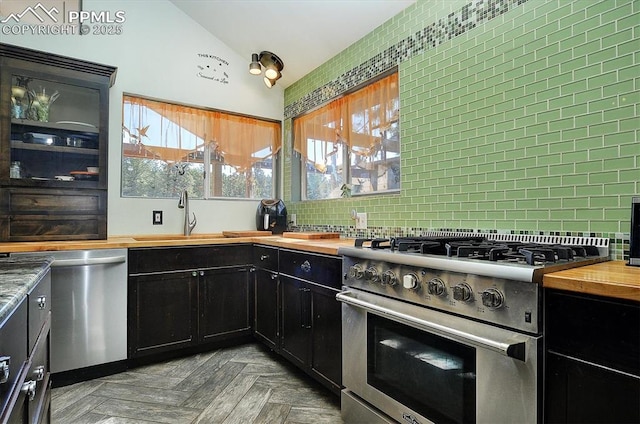 5581 County Road 328, Westcliffe, CO 81252 - kitchen with a sink, dark cabinetry, appliances with stainless steel finishes, and butcher block counters
