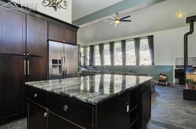 5581 County Road 328, Westcliffe, CO 81252 - kitchen featuring a ceiling fan, open floor plan, dark stone counters, stainless steel fridge with ice dispenser, and lofted ceiling