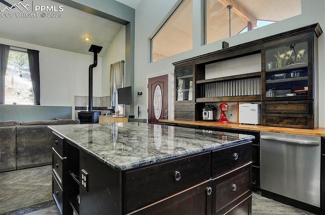 5581 County Road 328, Westcliffe, CO 81252 - kitchen with open shelves, stainless steel dishwasher, vaulted ceiling with beams, and a wood stove
