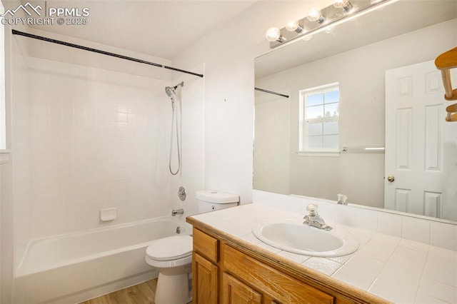 3272 Capstan Way, Colorado Springs, CO 80906 - bathroom with shower / washtub combination, wood finished floors, toilet, and vanity