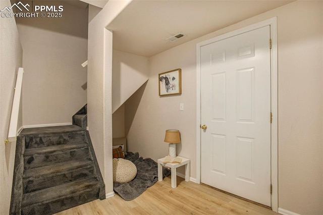 3272 Capstan Way, Colorado Springs, CO 80906 - staircase featuring wood finished floors, baseboards, and visible vents