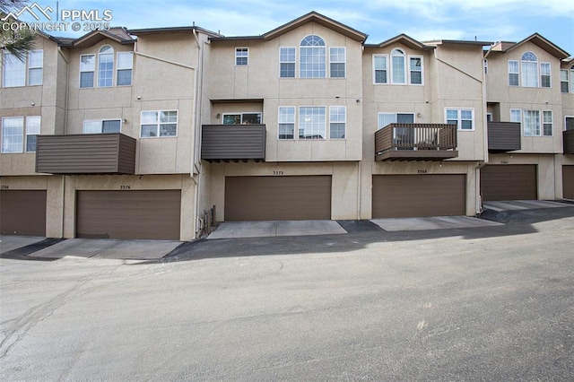 3272 Capstan Way, Colorado Springs, CO 80906 - view of front of house with stucco siding and an attached garage