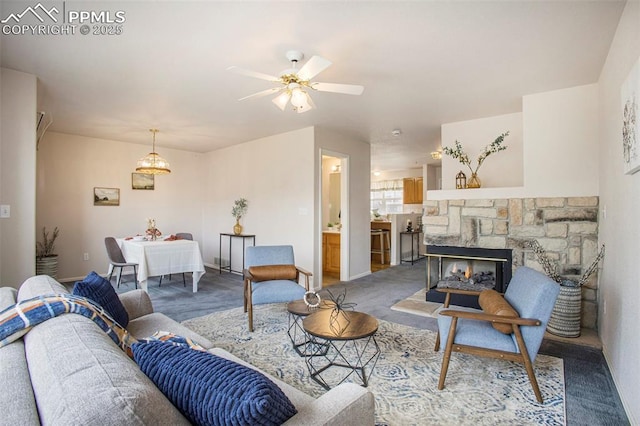 3272 Capstan Way, Colorado Springs, CO 80906 - living room with ceiling fan with notable chandelier, carpet floors, and baseboards