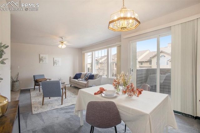 3272 Capstan Way, Colorado Springs, CO 80906 - carpeted dining space featuring ceiling fan with notable chandelier