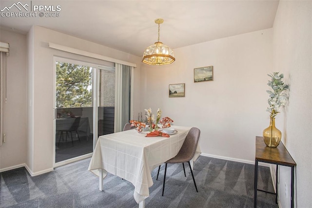 3272 Capstan Way, Colorado Springs, CO 80906 - dining area featuring baseboards, dark colored carpet, and a chandelier