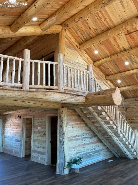 1906 Korlkoff Ln, Fort Garland, CO 81133 - stairs featuring beamed ceiling, wooden ceiling, high vaulted ceiling, and wood finished floors