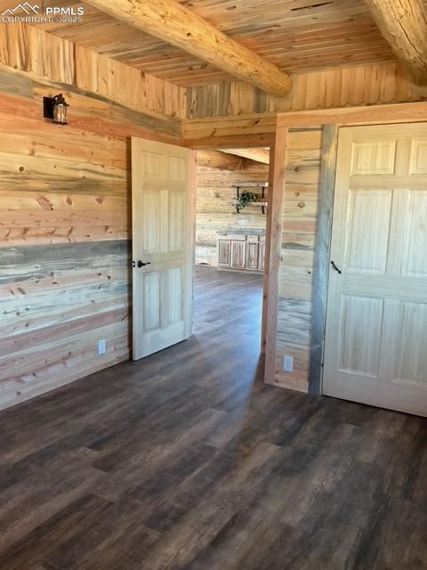 1906 Korlkoff Ln, Fort Garland, CO 81133 - interior space featuring beam ceiling, wood walls, wooden ceiling, and dark wood-type flooring